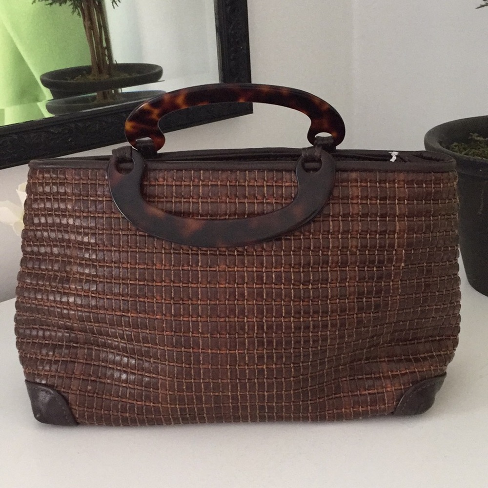 Maxx NY clutch. Tortoise handles-leather exterior